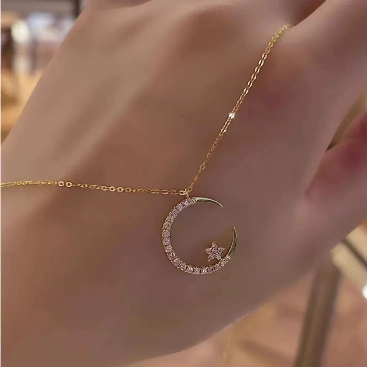 Star and Moon Necklace displayed on a white background highlighting craftsmanship